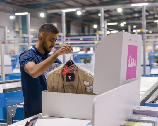 Employee packaging up clothes